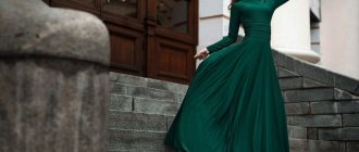 emerald dress on a girl who is on the stairs